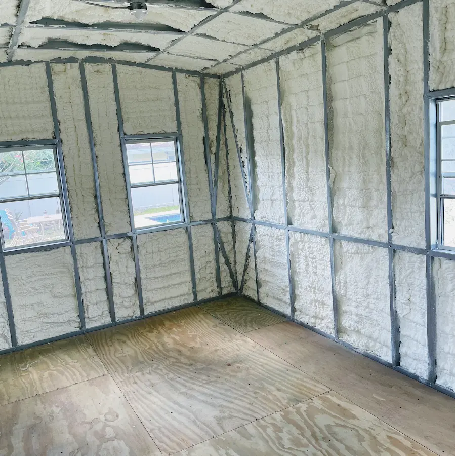 Closed-cell spray foam insulation applied to wall cavities in a residential project in Morris